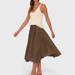 JONES + CO Angie skirt in chocolate brown Italian cotton poplin with a drawstring waist, worn by a model.