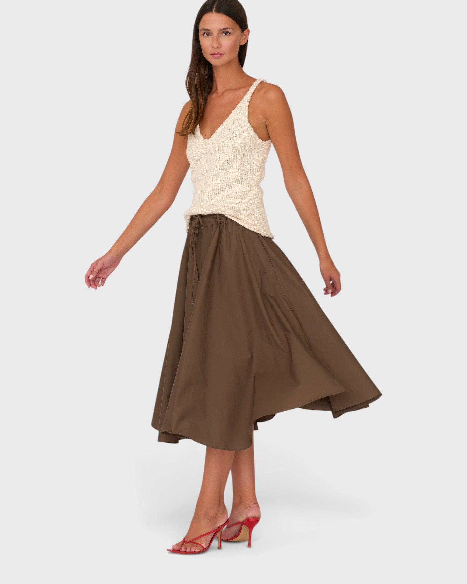 JONES + CO Angie skirt in chocolate brown Italian cotton poplin with a drawstring waist, worn by a model.