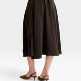 JONES + CO Angie skirt in chocolate brown with an elastic drawstring waistband and side slits, back view