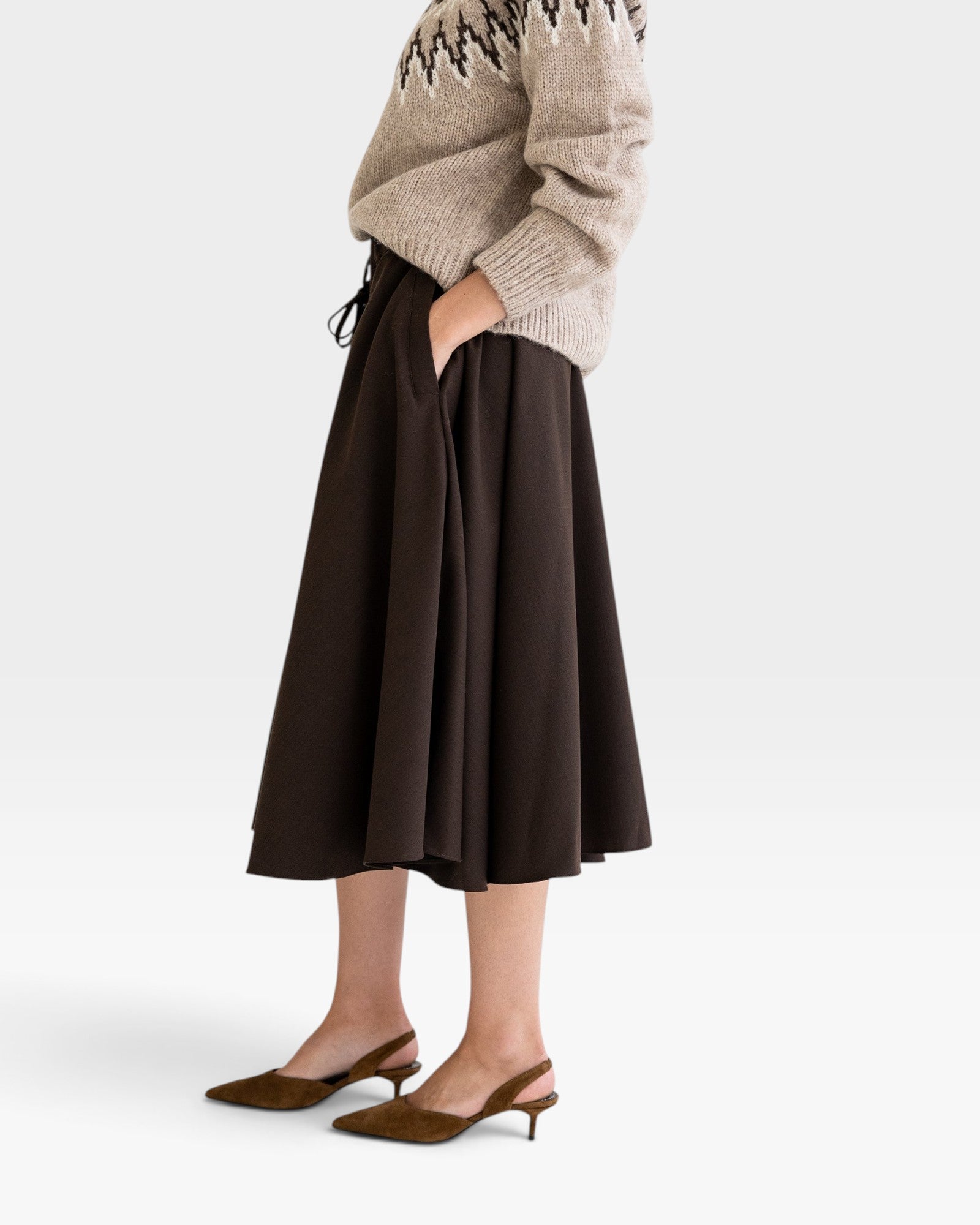 JONES + CO Angie Skirt in chocolate brown featuring side pockets, drawstring waist, and side slits on a model