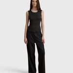 JONES + CO Iris anthracite rib knit tank top with a square neckline worn by a model with wide-leg trousers