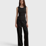 JONES + CO Iris anthracite rib knit tank top with a square neckline worn by a model with wide-leg trousers