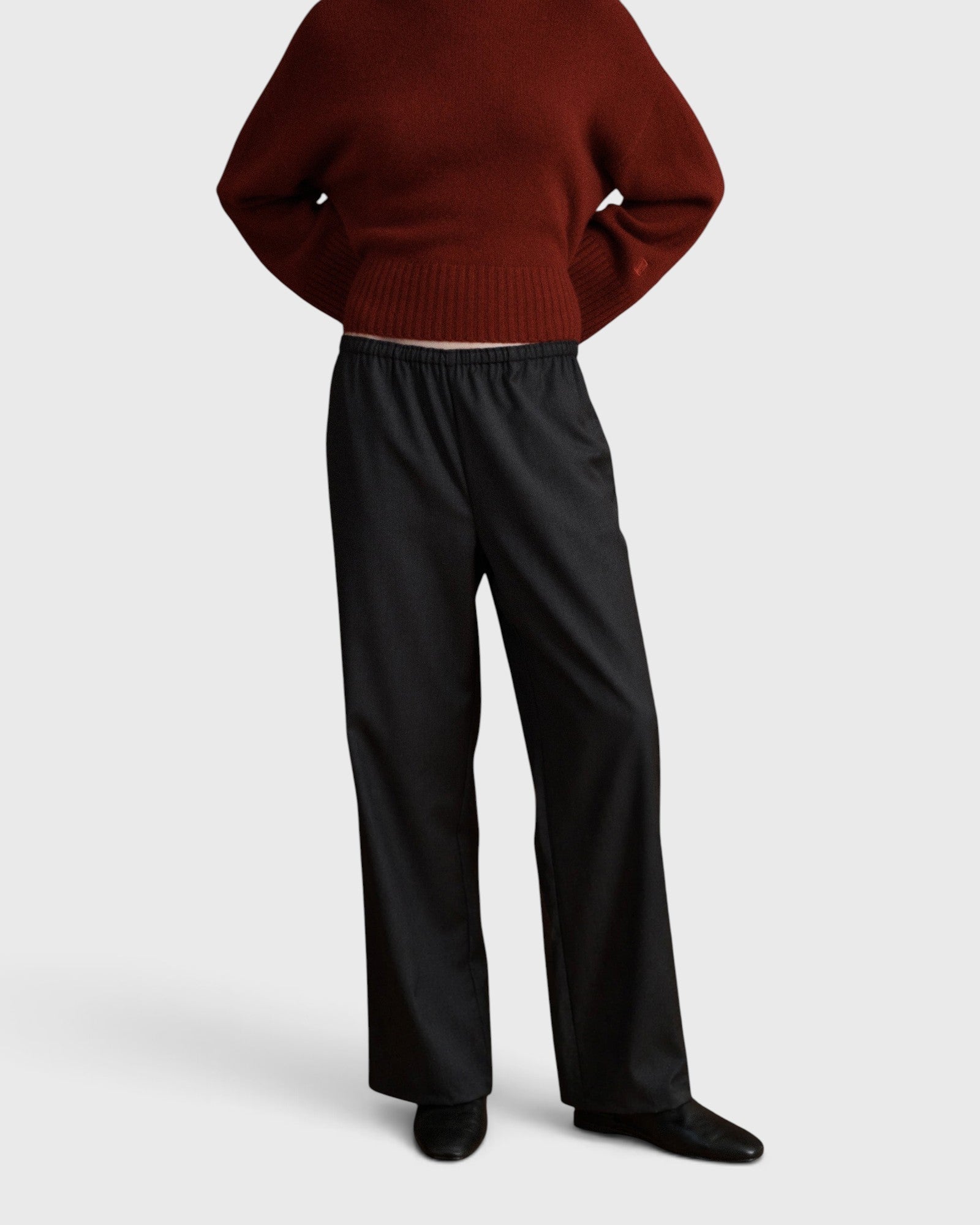 JONES + CO Joanna wool trousers in anthracite with a relaxed wide-leg fit and slim elastic waistband.