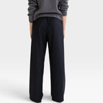 JONES + CO Joanna wool trousers in anthracite featuring a relaxed wide-leg fit and elastic waistband, back view.