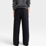JONES + CO Joanna wool trousers in anthracite featuring a relaxed wide-leg fit and elastic waistband, back view.