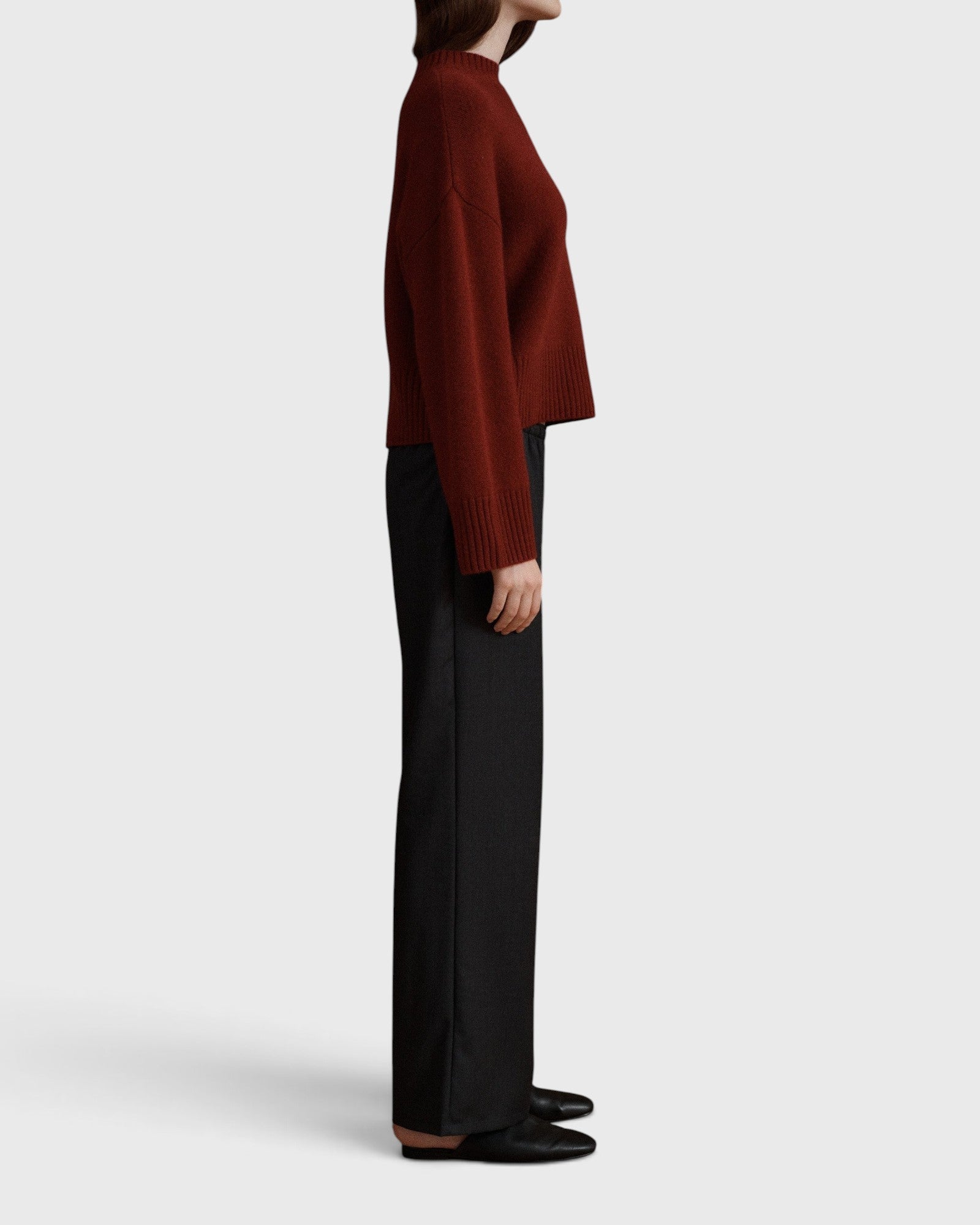 JONES + CO Joanna wool trousers in anthracite with a wide-leg fit and elastic waistband, shown from the side.