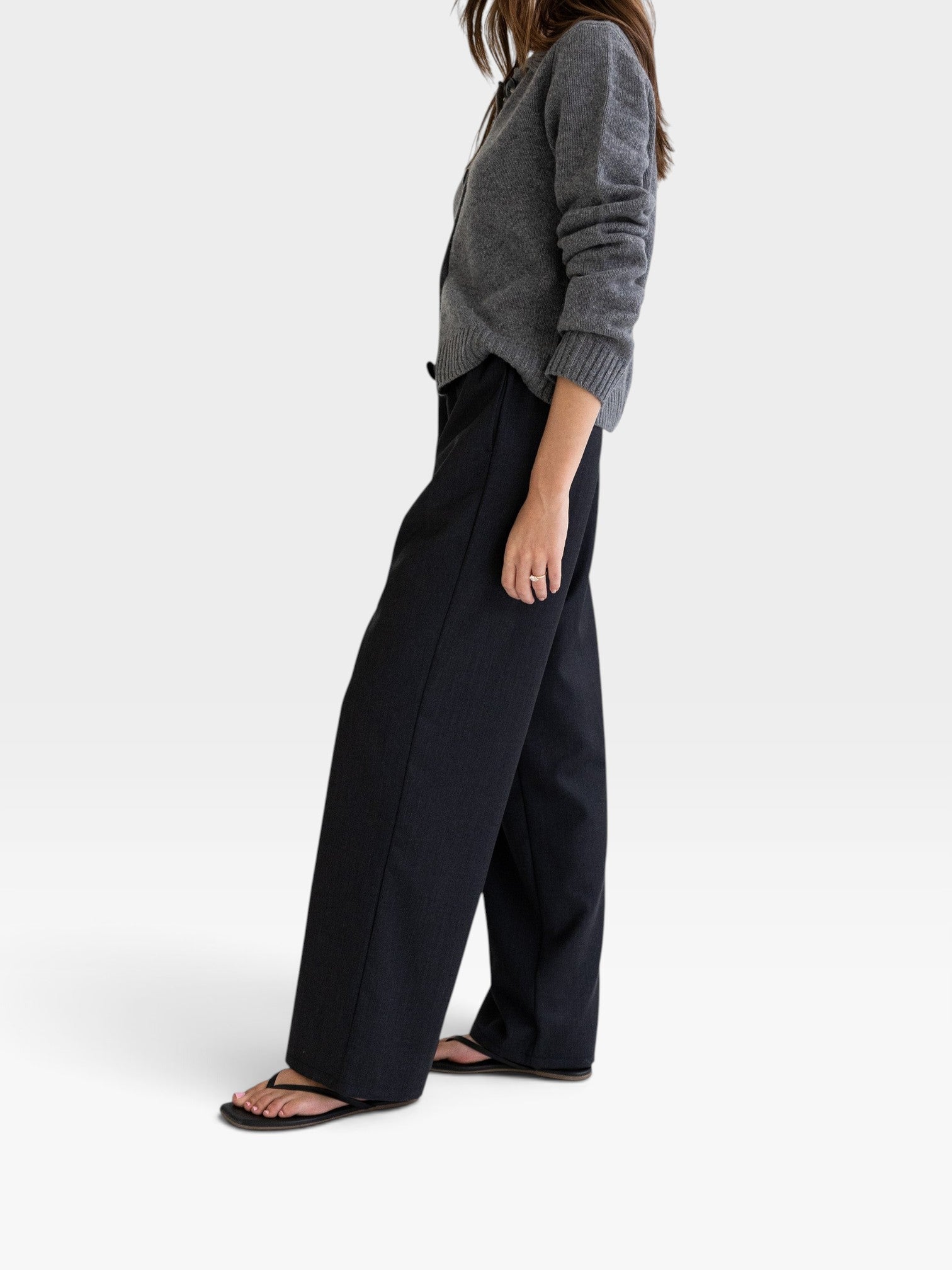 JONES + CO Joanna wool trousers in anthracite with a relaxed wide-leg fit and elastic waistband on a model
