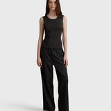 JONES + CO Joanna wool trousers in anthracite with a relaxed wide leg and elastic waistband worn by a model