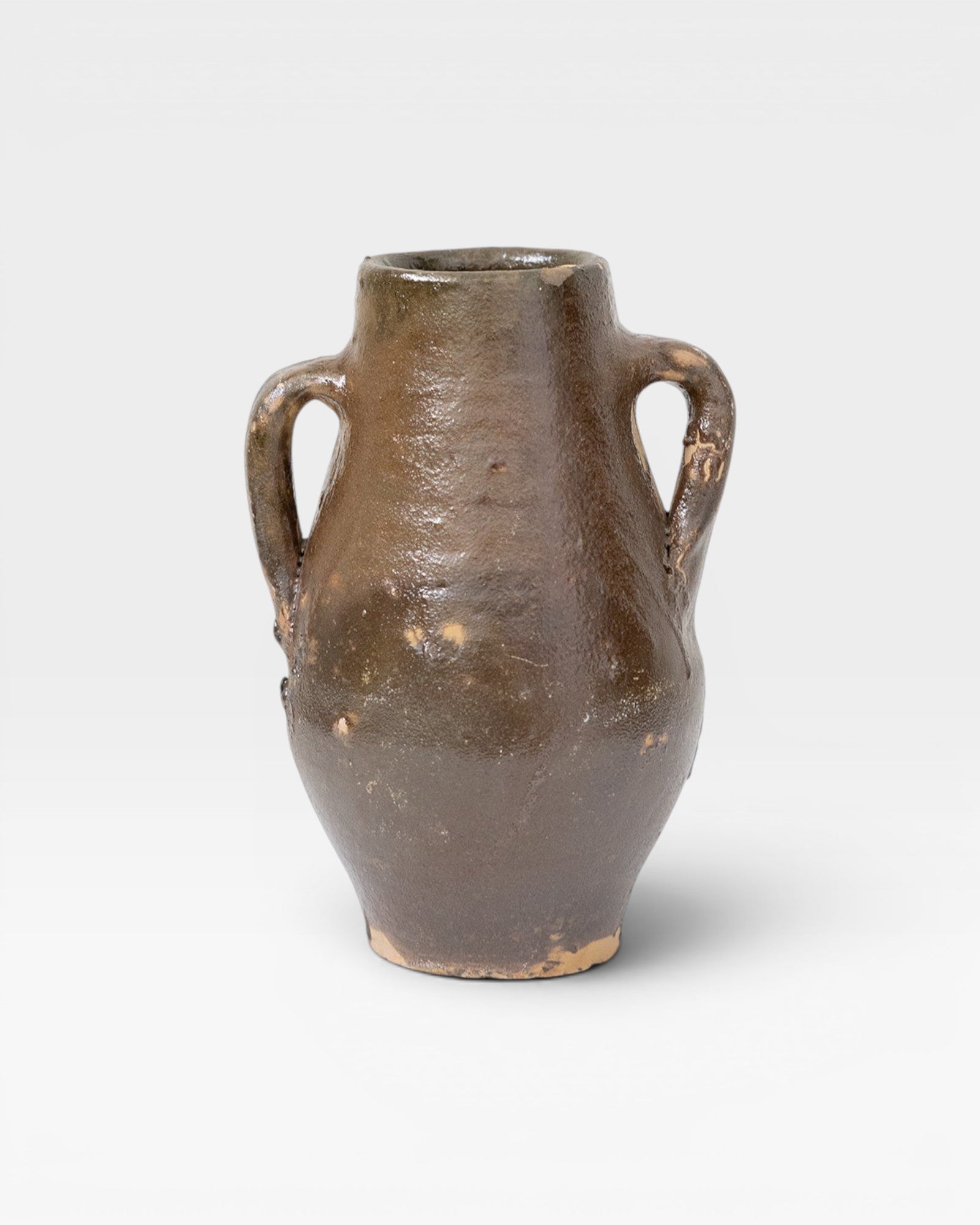 JONES + CO antique Turkish ceramic olive oil pot with aged patina and two handles. Dark brown glaze.