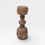 JONES + CO antique rustic wooden pillar with red paint traces and timeworn patina, used as sculptural accent or candle holder.