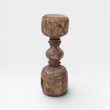 JONES + CO antique rustic wooden pillar with red paint traces and timeworn patina, used as sculptural accent or candle holder.