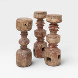 JONES + CO antique rustic wooden pillars, set of 3, with red paint patina and carved details.