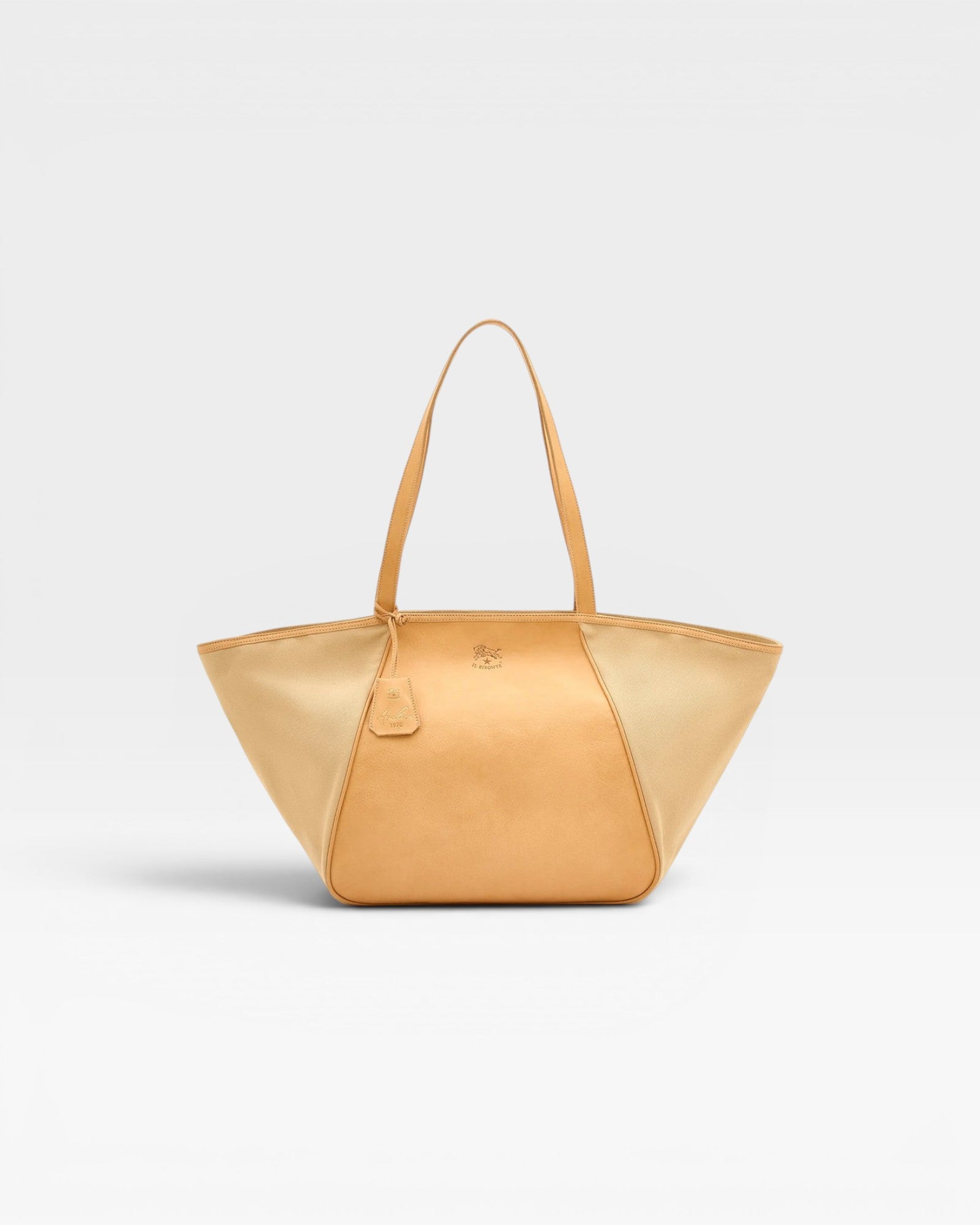 JONES + CO Archive 1970 tote bag in tan canvas and cowhide with a triangular silhouette and leather handles.