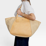 JONES + CO Archive 1970 tote bag in canvas and tan cowhide with leather trim and shoulder straps.