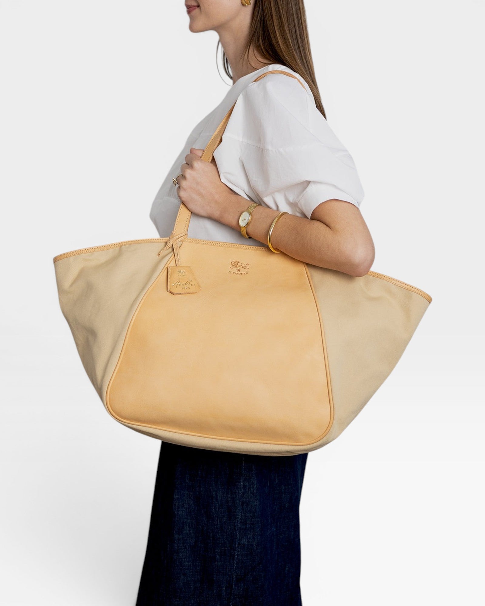 JONES + CO Archive 1970 tote bag in canvas and tan cowhide with leather trim and shoulder straps.