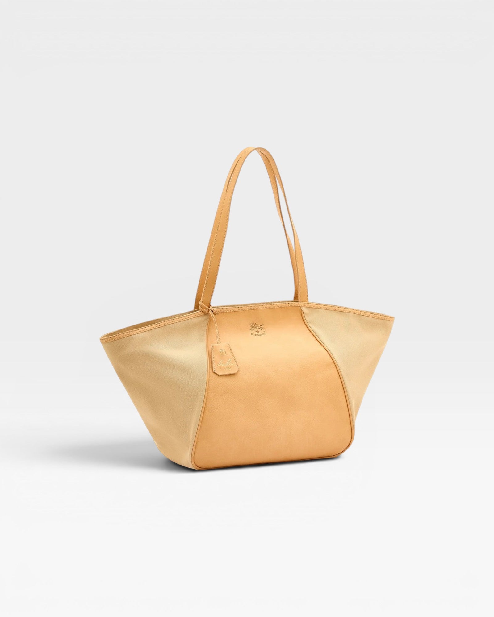 JONES + CO Archive 1970 tote bag in tan canvas and cowhide leather with dual shoulder straps and a leather logo tag.