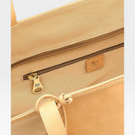 JONES + CO Archive 1970 tote bag in tan canvas with leather trim and brass zipper.