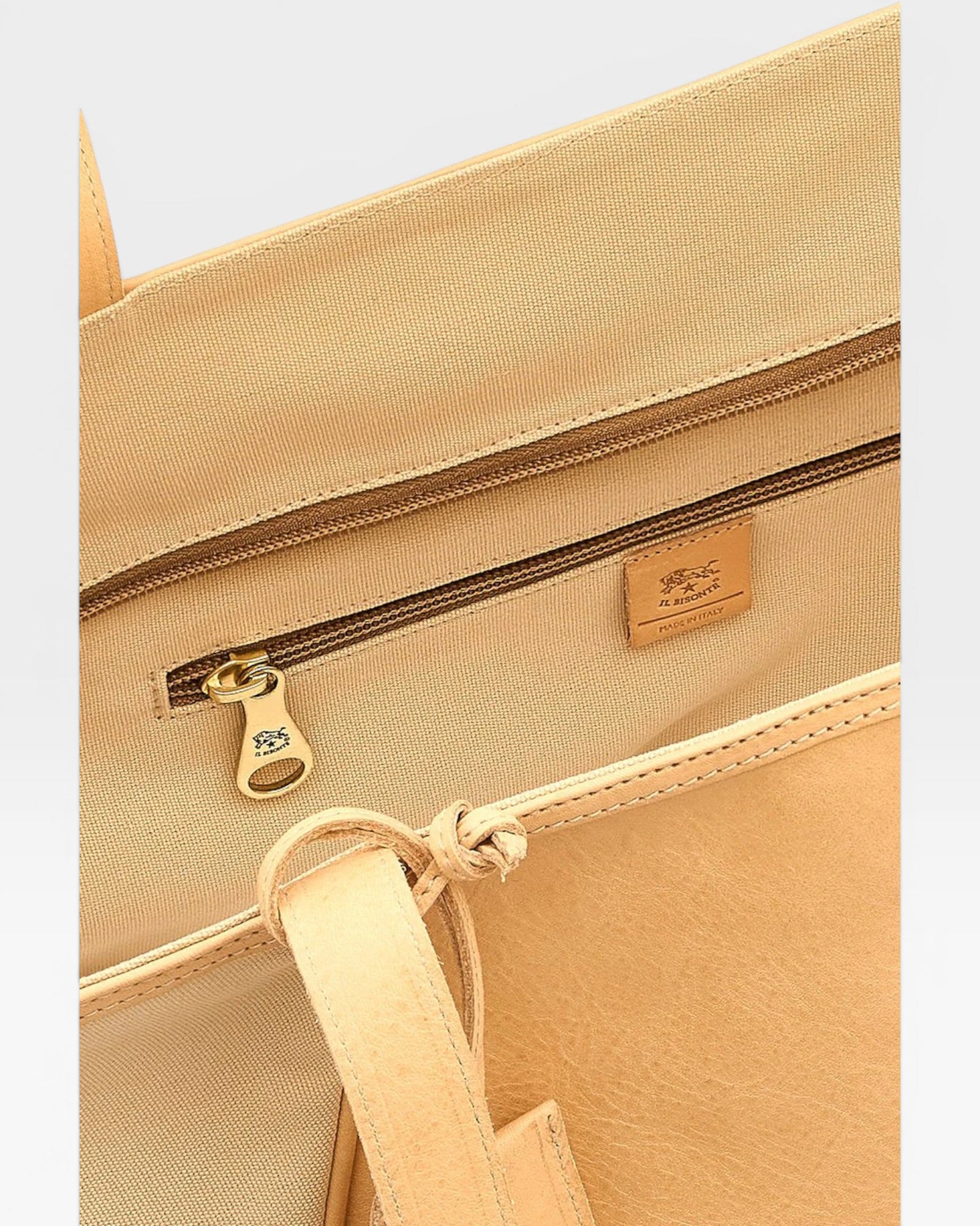 JONES + CO Archive 1970 tote bag in tan canvas with leather trim and brass zipper.