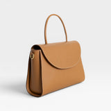 JONES + CO Archive 1978 Linea Top Handle Bag in Gianduia brown vegetable-tanned leather with rounded flap and knotted handle.