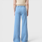 JONES + CO Aria flared jeans in light blue stretch denim with high waist and patch pockets, back view.