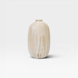 JONES + CO handthrown ceramic vase with ash glaze in natural beige and white drip effect.