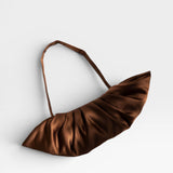 JONES + CO Babette Bag in chocolate brown satin with ruched detailing and a single strap. Perfect for evening wear.