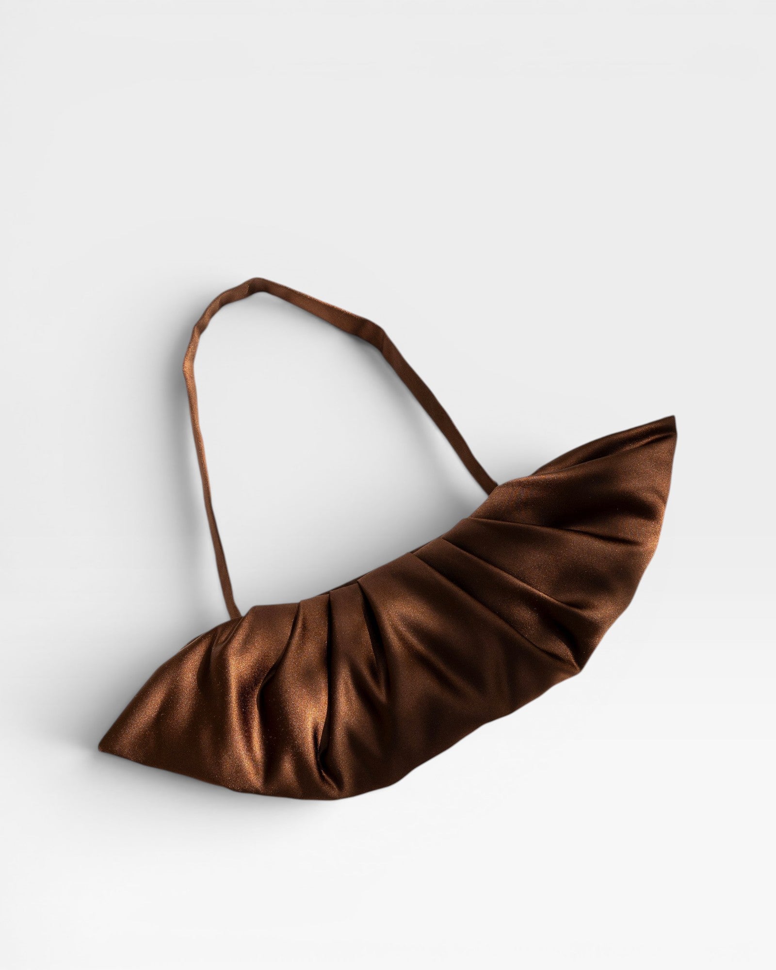 JONES + CO Babette Bag in chocolate brown satin with ruched detailing and a single strap. Perfect for evening wear.