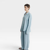 JONES + CO baby blue oversized linen button-down shirt with long sleeves and matching pants.