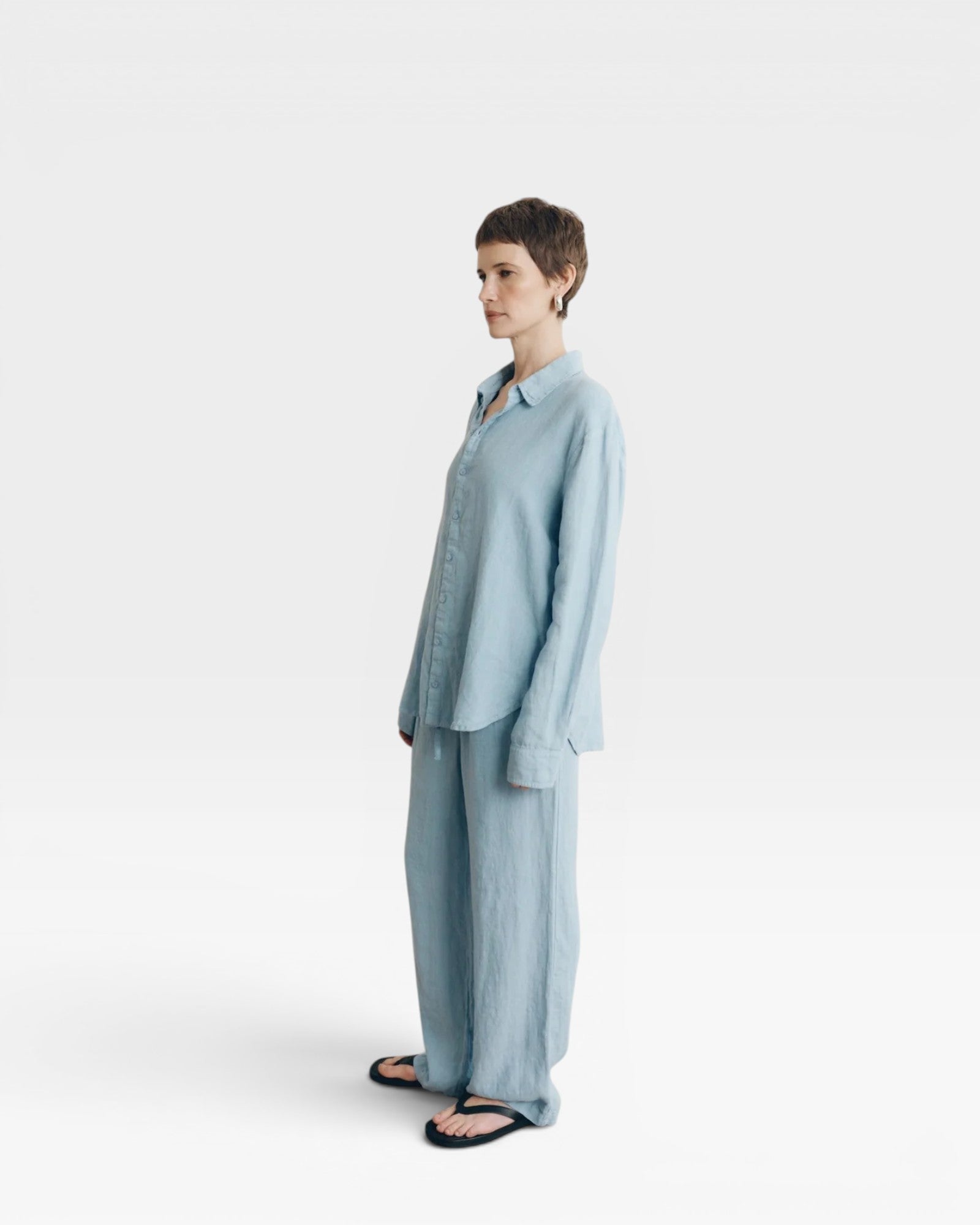 JONES + CO baby blue oversized linen button-down shirt with long sleeves and matching pants.