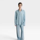 JONES + CO baby blue oversized linen button-down shirt with matching wide-leg pants.