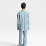 JONES + CO baby blue oversized linen shirt and matching wide-leg pants on a model.
