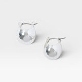 JONES + CO Baby Keel Hoop mini hollow oblong silver hoop earrings with hinged fastening.