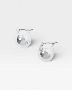 JONES + CO Baby Keel Hoop mini hollow oblong silver hoop earrings with hinged fastening.