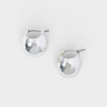 JONES + CO Baby Keel Hoop mini hollow oblong silver hoop earrings with hinged fastening.