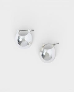 JONES + CO Baby Keel Hoop mini hollow oblong silver hoop earrings with hinged fastening.