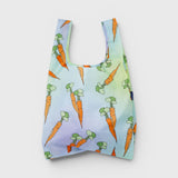 JONES + CO Baggu reusable nylon grocery bag featuring a colourful carrot pattern on a soft pastel gradient background.