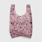 JONES + CO Standard Baggu reusable shopping bag in pink featuring a whimsical floral and castle creature print.