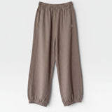JONES + CO mushroom brown balloon pants with elastic waist, side panels, and elastic leg opening.