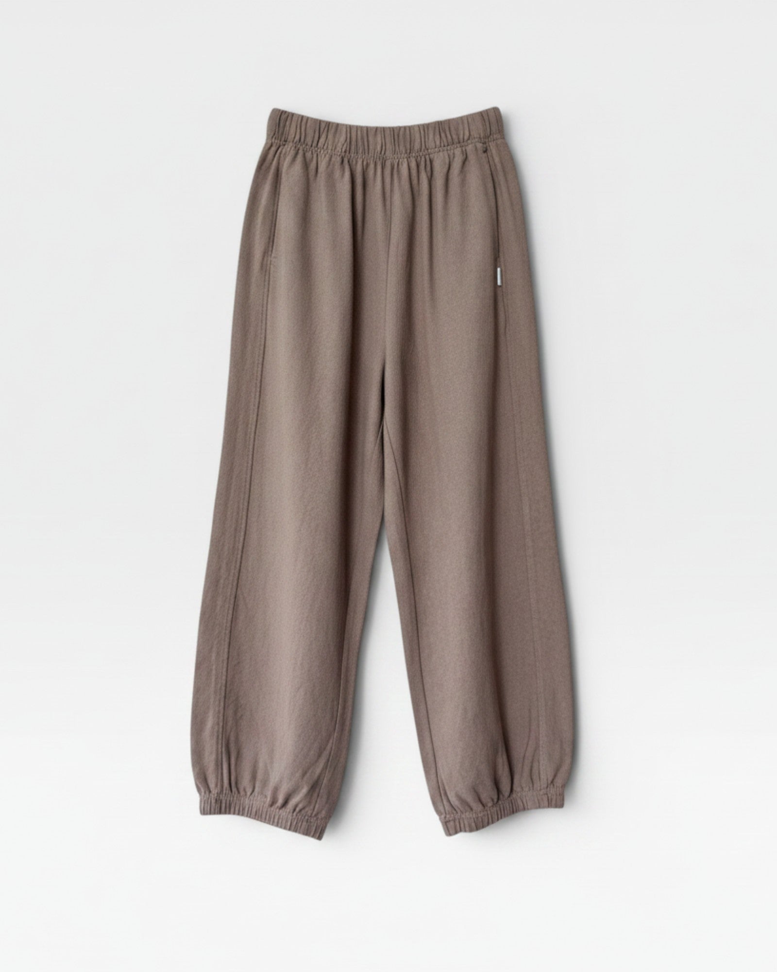 JONES + CO mushroom brown balloon pants with elastic waist, side panels, and elastic leg opening.