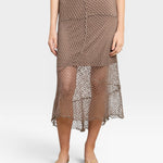 JONES + CO bark brown crochet midi skirt with an asymmetrical hem and open knit pattern.