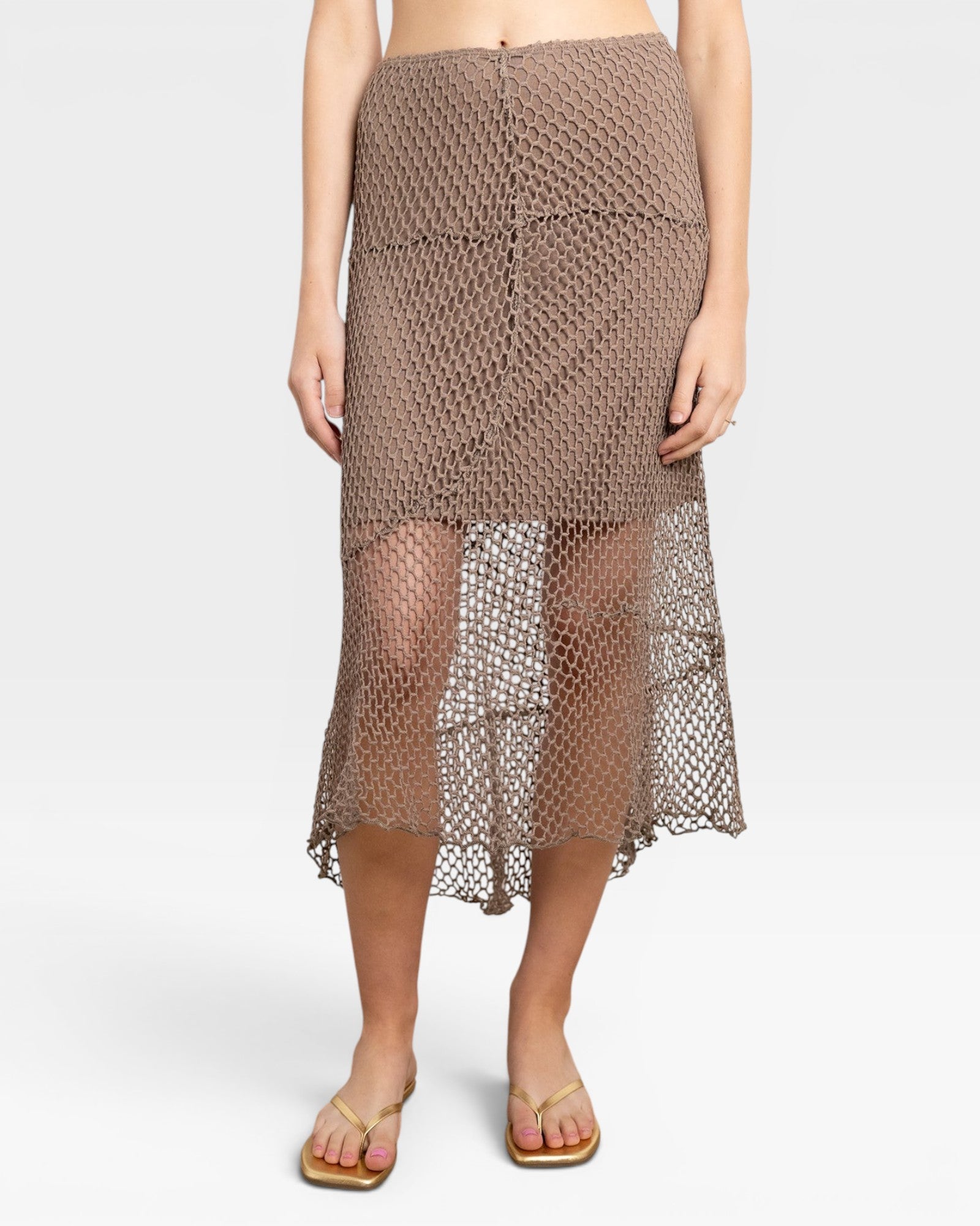 JONES + CO bark brown crochet midi skirt with an asymmetrical hem and open knit pattern.