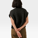 Back view of a model wearing a JONES + CO basalt grey alpaca blend button-down vest with a straight hem.