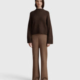JONES + CO Bettina cashmere mock-neck sweater in oak brown with balloon sleeves worn with matching knit trousers