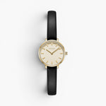 JONES + CO Beverly watch featuring a gold case, minimalist cream dial, and black leather strap on a white background.