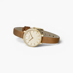 JONES + CO Beverly watch featuring a gold case, cream dial, and brown leather strap on a white background.