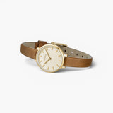 JONES + CO Beverly watch featuring a gold case, cream dial, and brown leather strap on a white background.