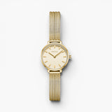JONES + CO Beverly gold mesh watch with a round case and minimalist champagne dial on a woven bracelet