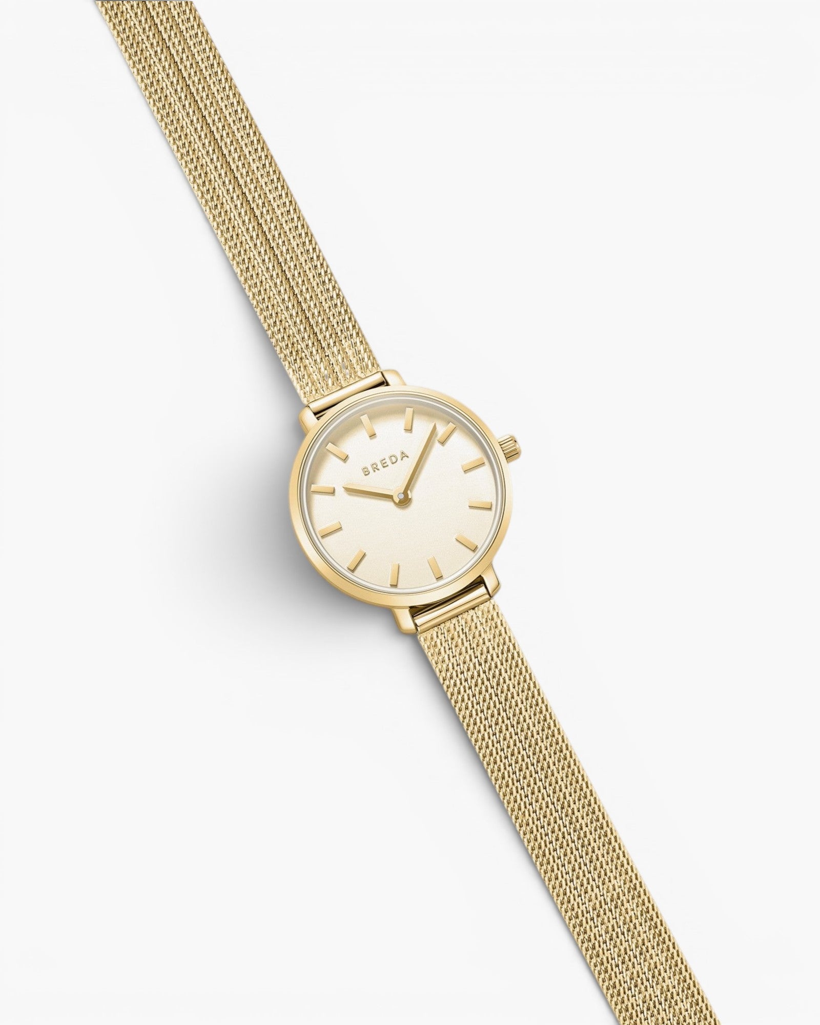 JONES + CO Beverly gold mesh watch with a delicate oval case and champagne dial on a tapered woven bracelet.