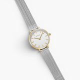 JONES + CO Beverly mesh watch featuring a silver stainless steel strap and a round gold-tone case with a white dial.