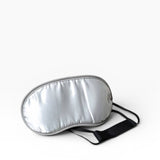 JONES + CO Morihata Binchotan Charcoal Eye Mask in silver satin with grey trim and black adjustable strap.